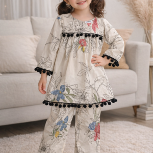 Little girl wearing a floral printed rayon cord set with pom-pom lace detailing, featuring a long kurti and matching pants, styled for kids fashion.