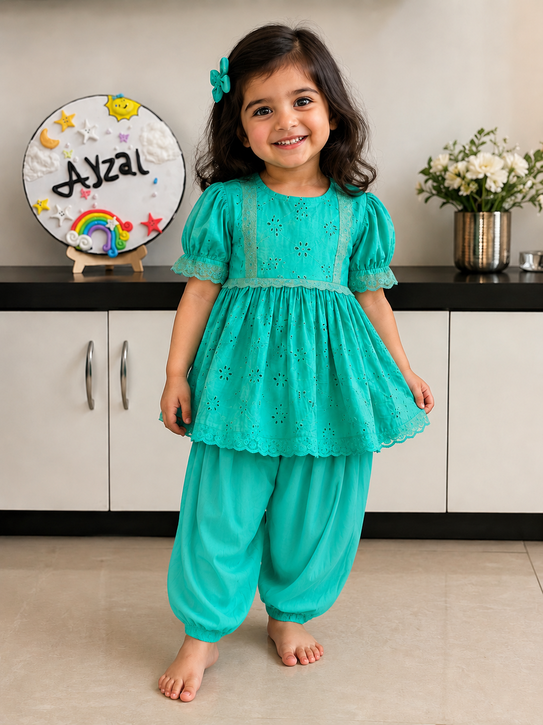 Girls turquoise Hakoba embroidered top with lace detailing paired with cotton Afghani salwar.
