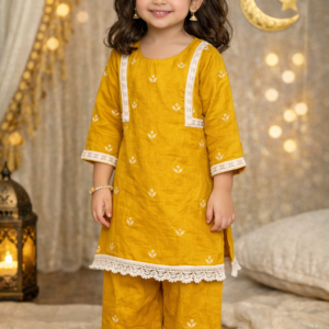 Little girl wearing mustard yellow cotton kurti palazzo set with white lace detailing
