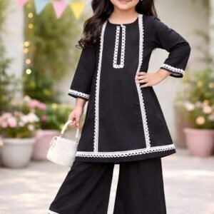 Girl wearing black rayon kurti with white lace detailing and matching palazzo set