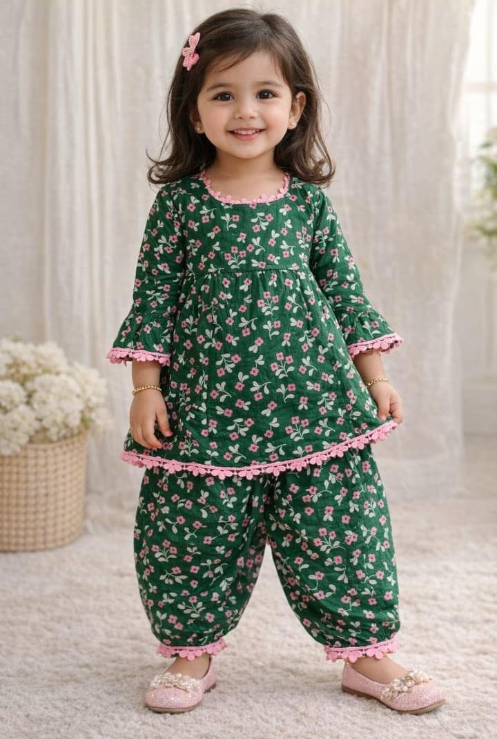 Green floral cotton kurti with matching dhoti pants and pink lace detailing for girls